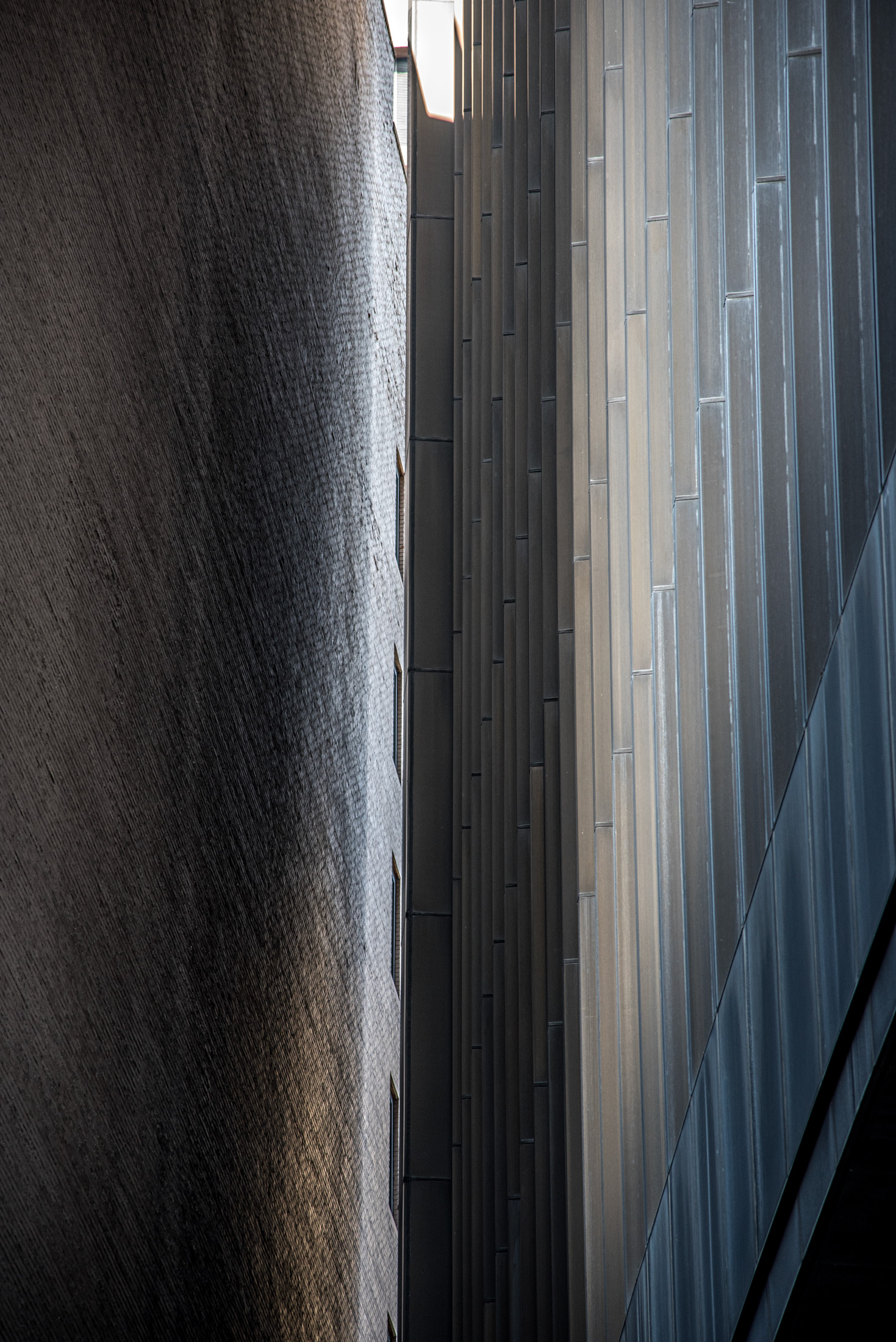 City Canyon — Light falls through a narrow canyon of glass and stone in downtown Boston