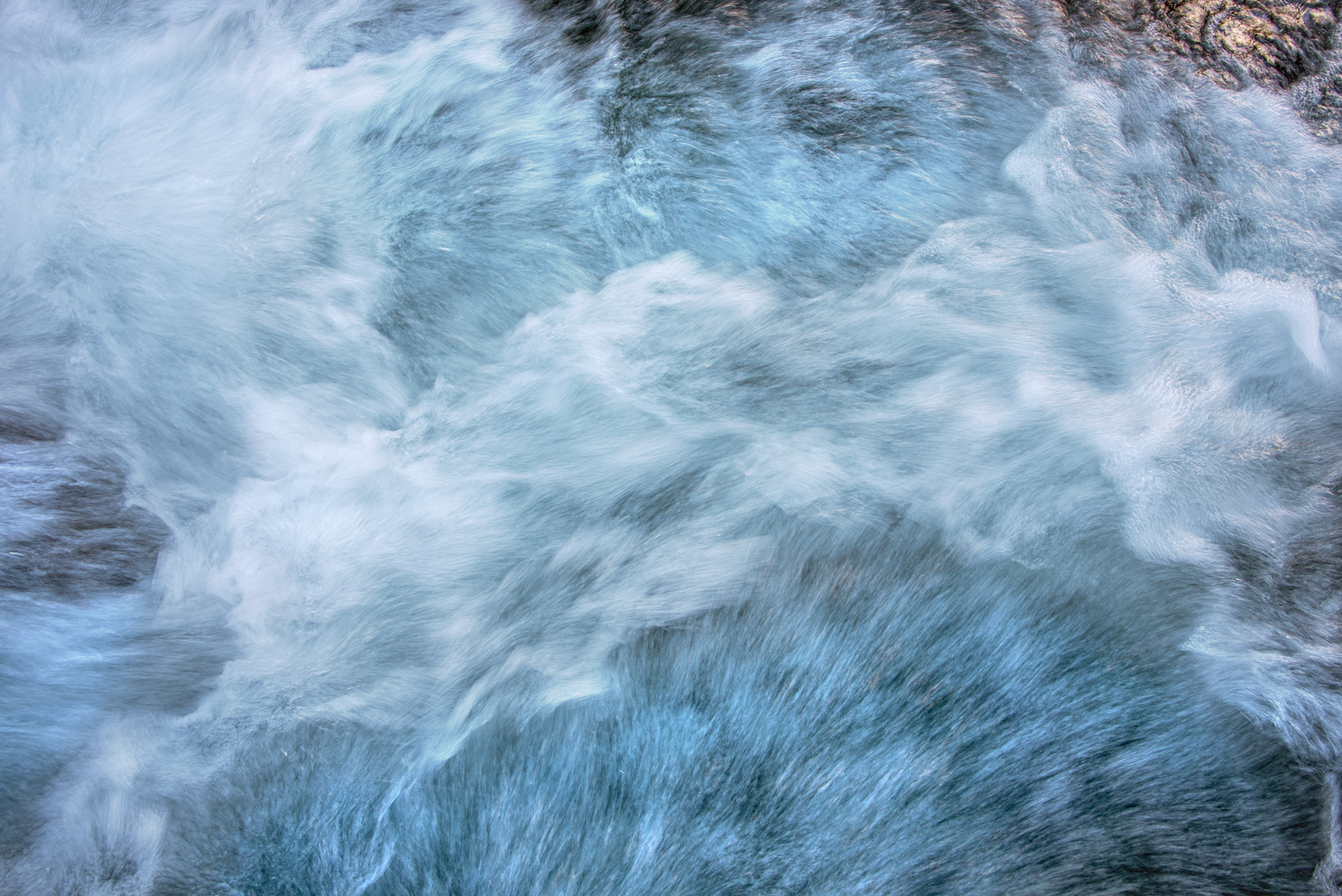 The River in Motion — Churning whitewater dissolves into smoke and silk in the mountains of Washington State