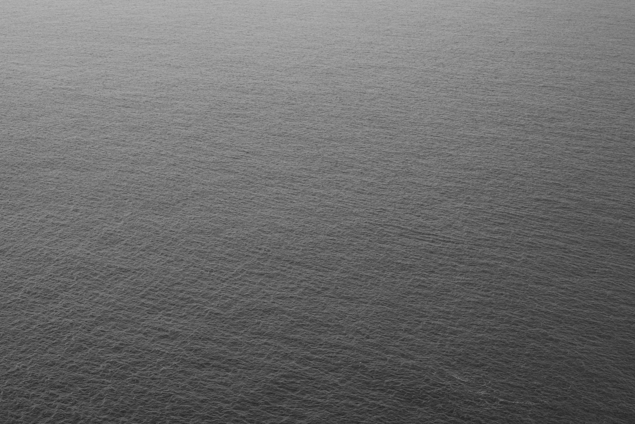 The Quiet Weight of Water — Subtle ripples across the Pacific Ocean capture the quiet rhythm and timeless beauty of California's coast.