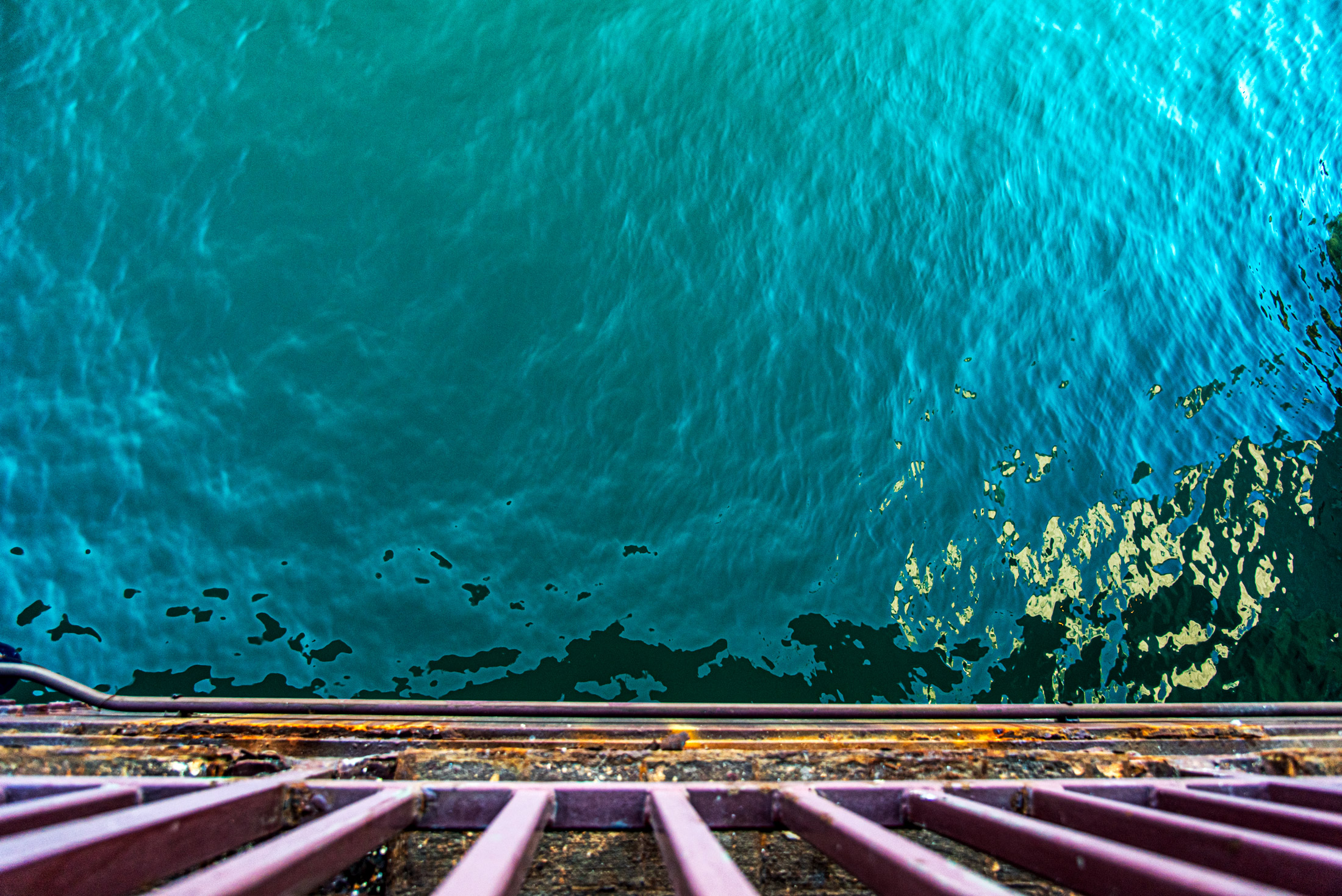 The Lake Below — Looking down into the turquoise water of Lake Michigan from a Chicago pier