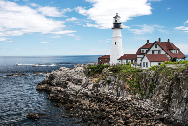 Portland Head Light — Portland Head Light and its red-roofed keeper's house stand over the rocks of Cape Elizabeth, Maine
