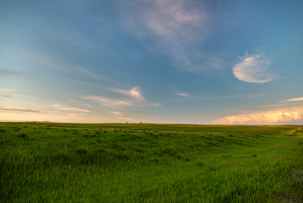 South Dakota Skies — An endless sky opens over the green grasslands of South Dakota