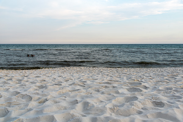 Evening Along the Gulf — The calm waters and bright white sands of Destin Beach come together beneath a soft evening sky in Florida.